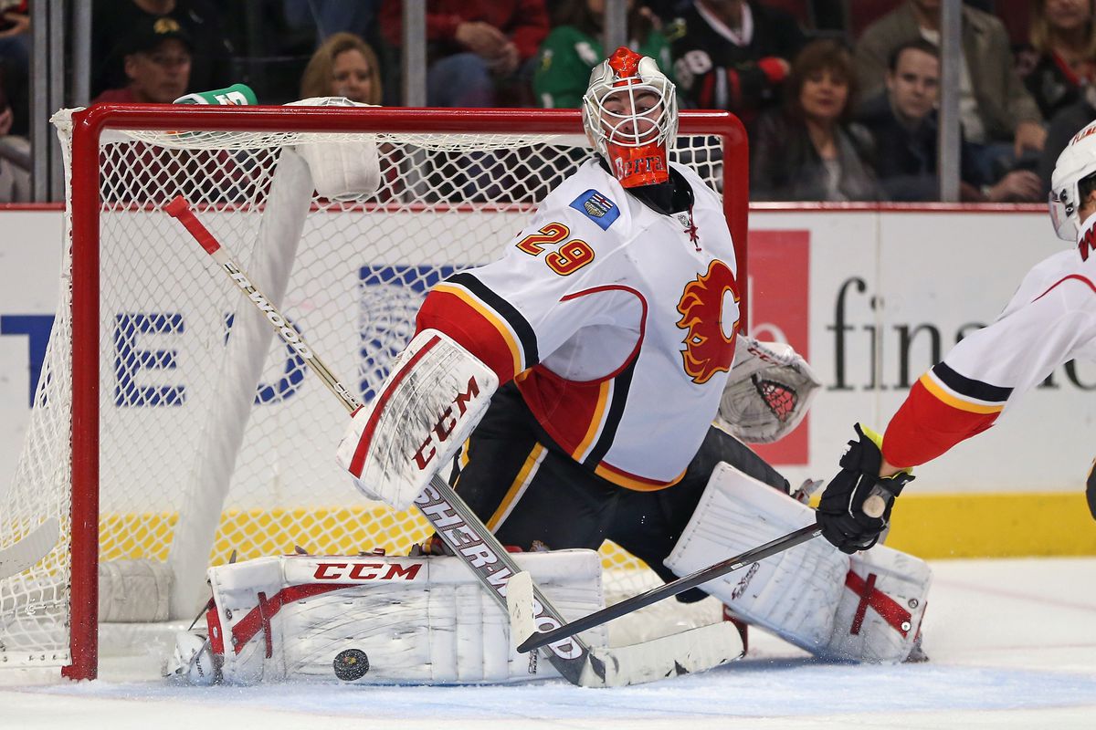 Reto Berra makes one of his 42 saves of the night.