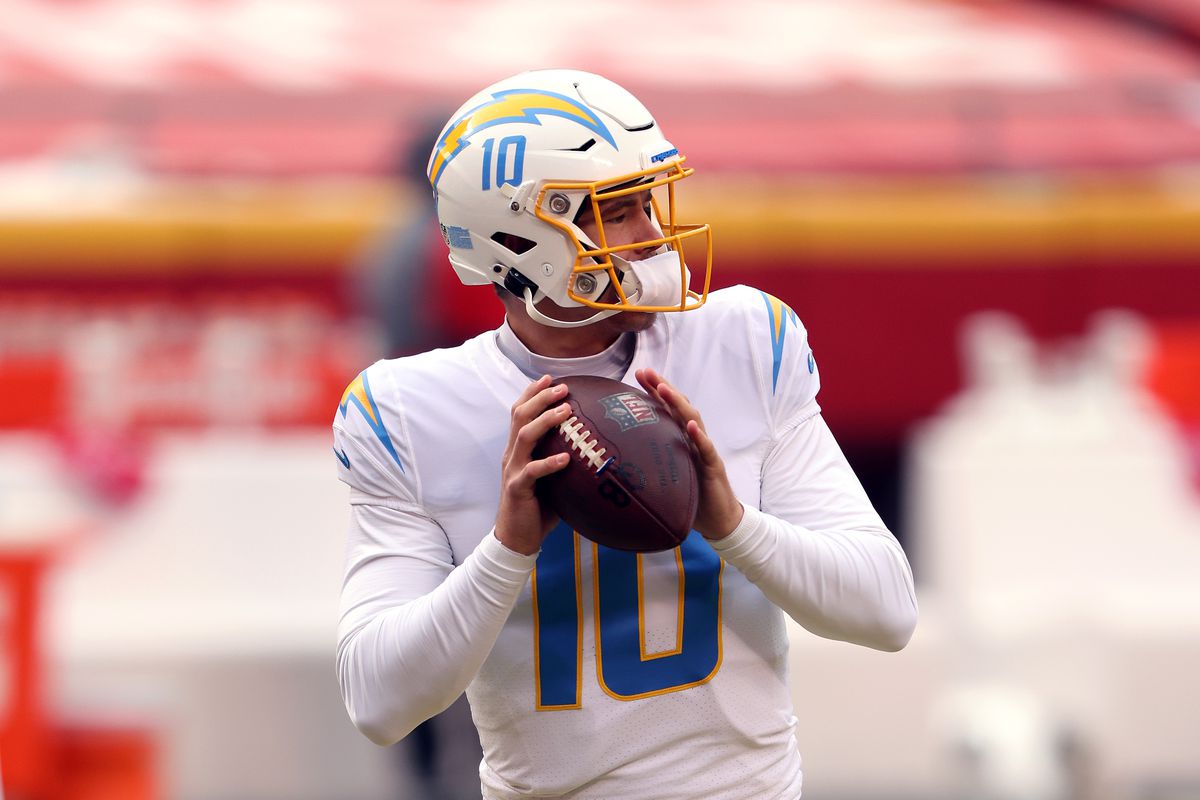 Justin Herbert #10 of the Los Angeles Chargers warms up prior to the game against the Kansas City Chiefs at Arrowhead Stadium on January 03, 2021 in Kansas City, Missouri.