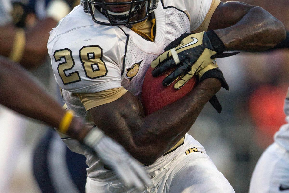 Aug 30, 2012; Akron, OH, USA; Central Florida Knights running back Latavius Murray (28) runs with the ball for a touchdown against the Akron Zips at InfoCision Stadium. Mandatory Credit: Rob Leifheit-US PRESSWIRE