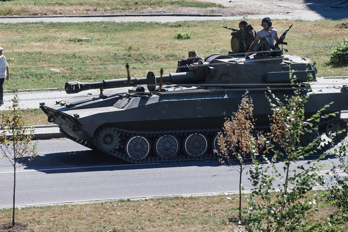 Pro-Russia rebels drive a tank in Donetsk