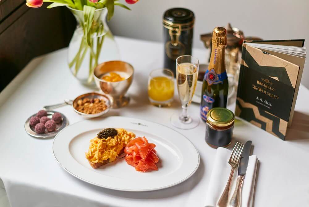 A Mother’s Day restaurant kit from The Wolseley, comprising a plate of scrambled eggs on toast with salmon and caviar, champagne, tea, and truffles