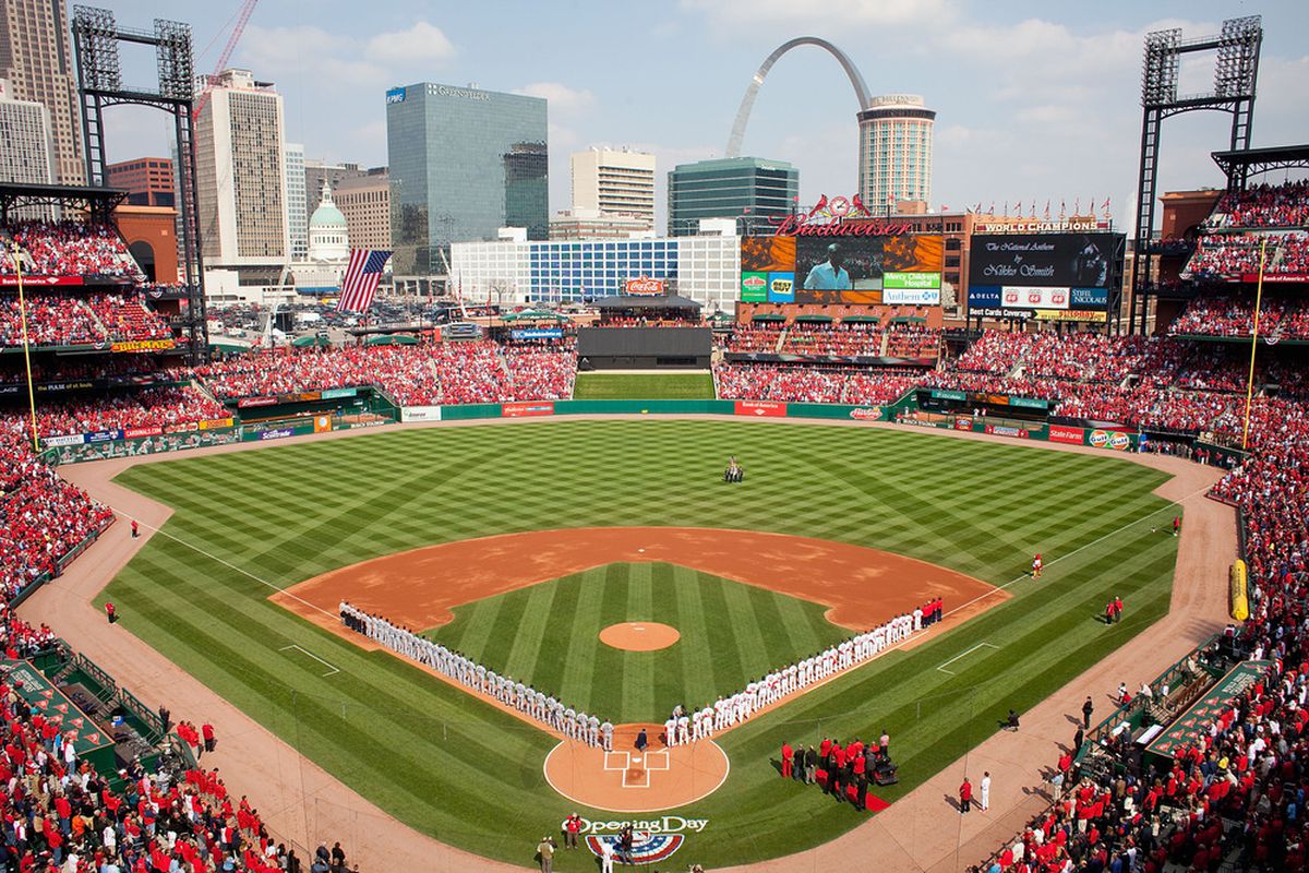ST. LOUIS, MO - MARCH 31: Members of the St. Louis Cardinals and San Diego Padres line up for the National Anthem on opening day at Busch Stadium on March 31, 2011 in St. Louis, Missouri.  (Photo by Dilip Vishwanat/Getty Images)