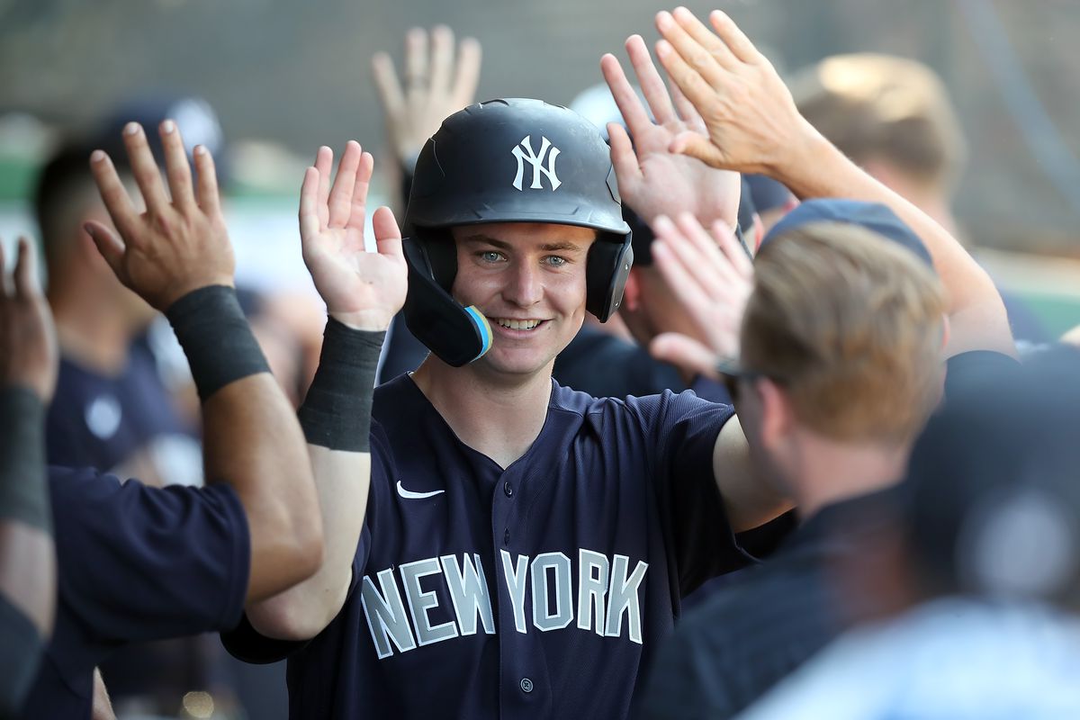 New York Yankees infielder Trey Sweeney (54) is congratulated for scoring during the spring training game between the New York Yankees and the Philadelphia Phillies on February 25, 2023 at BayCare Ballpark in Clearwater, Florida.