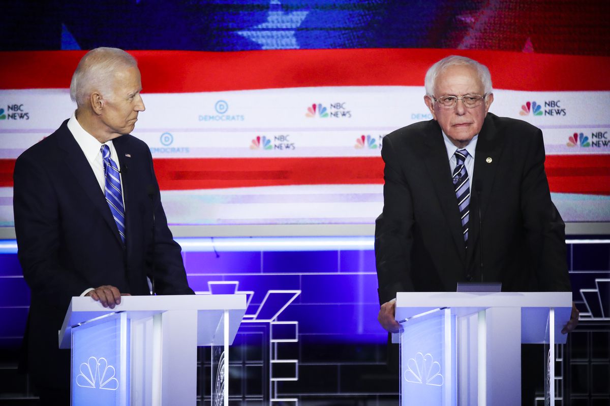 Democratic presidential candidate former Vice President Joe Biden and Sen. Bernie Sanders (I-VT) look on during the second night of the first Democratic presidential debate on June 27, 2019.