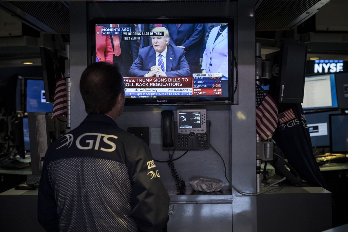 A trader watches President Donald Trump on a monitor at the New York Stock Exchange in March 2017.