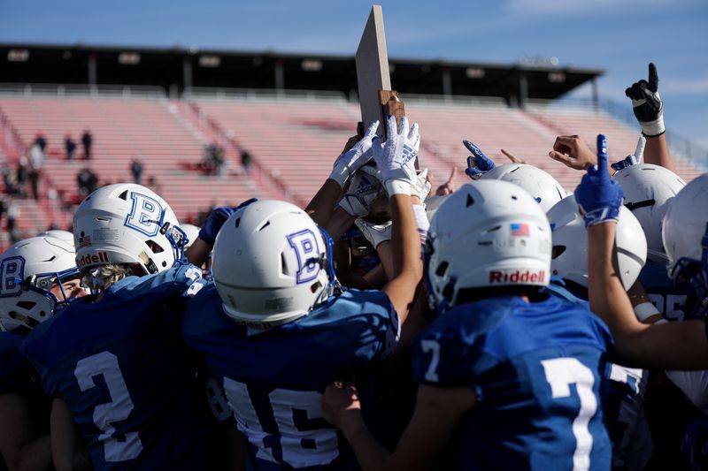 Beaver players celebrate their win over Duchesne in the 2A football championship game at Dixie State University in St. George on Saturday, Nov. 14, 2020.