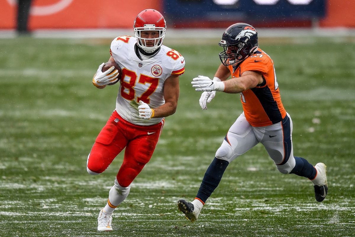 Travis Kelce #87 of the Kansas City Chiefs runs and is chased down by Josey Jewell #47 of the Denver Broncos after a third quarter catch at Empower Field at Mile High on October 25, 2020 in Denver, Colorado.
