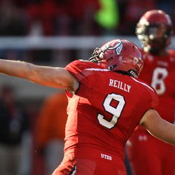 Utah defensive end Trevor Reilly (9) throws the ball into the crowd after making an interception at the end of a football game against Colorado at the Rice-Eccles Stadium in Salt Lake City on Saturday, Nov. 30, 2013.