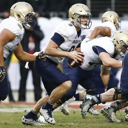 Navy quarterback Zach Abey (9) carries the ball for a touchdown against Louisiana Tech during first half of the Armed Forces Bowl NCAA college football game, Friday, Dec. 23, 2016, in Fort Worth, Texas. (AP Photo/Jim Cowsert)
