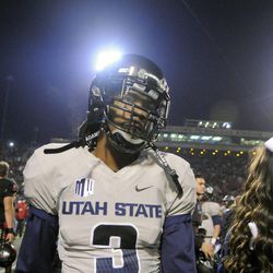 Utah State Aggies cornerback Quinton Byrd (3) walks off the field following the Aggies 24-17 loss to Fresno State in the Mountain West football championship game at Bulldog Stadium in Fresno, Calif., on Saturday, Dec. 7, 2013.