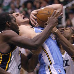 Utah's Paul Millsap and teammate Alec Burks try to stop Denver's Danilo Gallinari as he drives into the paint as the Utah Jazz and the Denver Nuggets play Wednesday, April 3, 2013 in Salt Lake City at EnergySolutions Arena. Denver beat the Jazz 113-96.