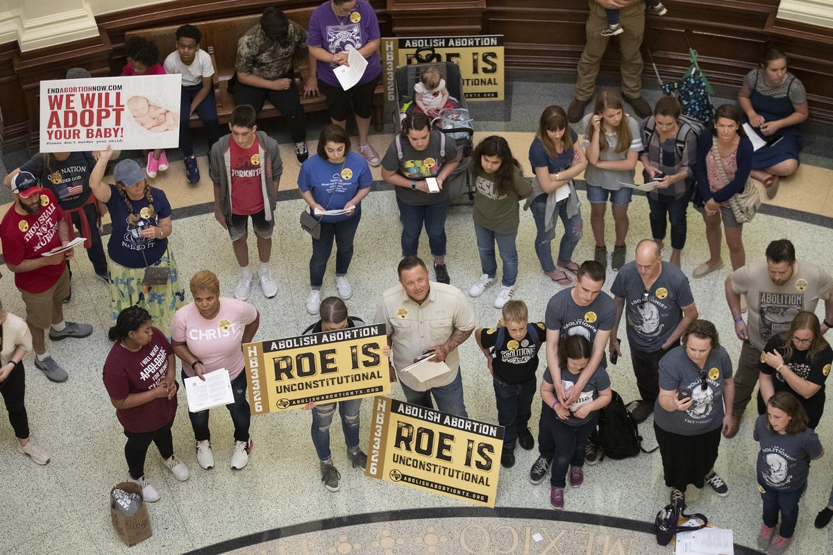 In this March 30, 2021, file photo, abortion opponents gather in the rotunda at the Texas Capitol while the Senate debates anti-abortion bills in Austin, Texas. 