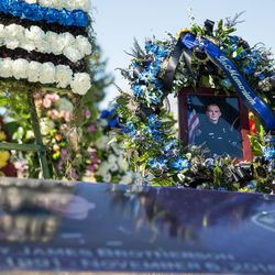 A photograph of West Valley City police officer Cody Brotherson is displayed before a graveside service for Brotherson at Valley View Memorial Park in West Valley City on Monday, Nov. 14, 2016.