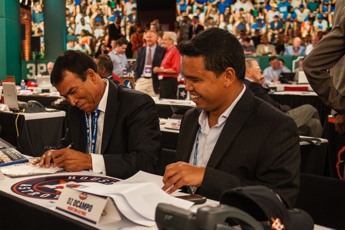 Houston Astros representatives Jose Cruz and Oz Ocampo talk with Murray Cook seen during the 2013 First-Year Player Draft at MLB Network’s Studio 42 on June 6, 2013 in Secaucus, New Jersey.