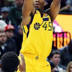 Utah Jazz guard Donovan Mitchell takes a shot with LA Clippers guard Tyrone Wallace defending during NBA basketball in Salt Lake City on Saturday, Jan. 20, 2018.
