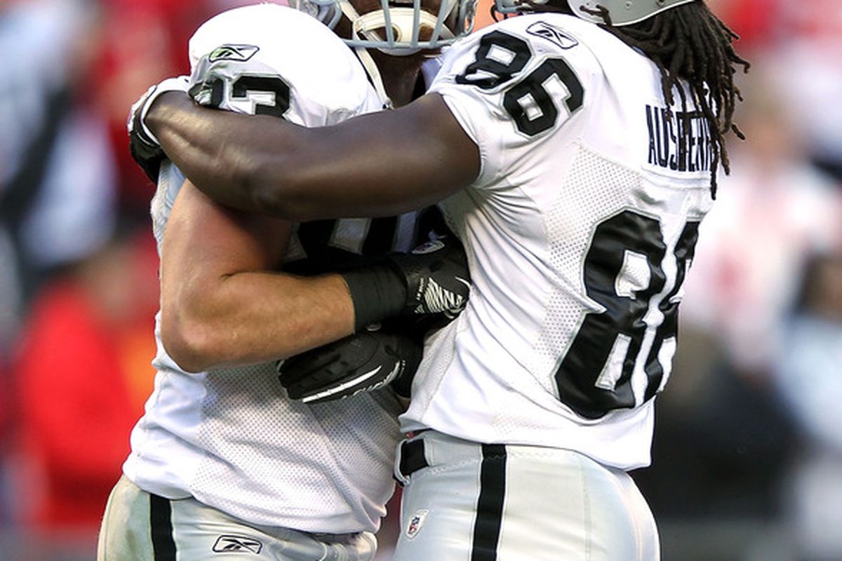 Brandon Myers #83 of the Oakland Raiders is congratulated by David Ausberry #86