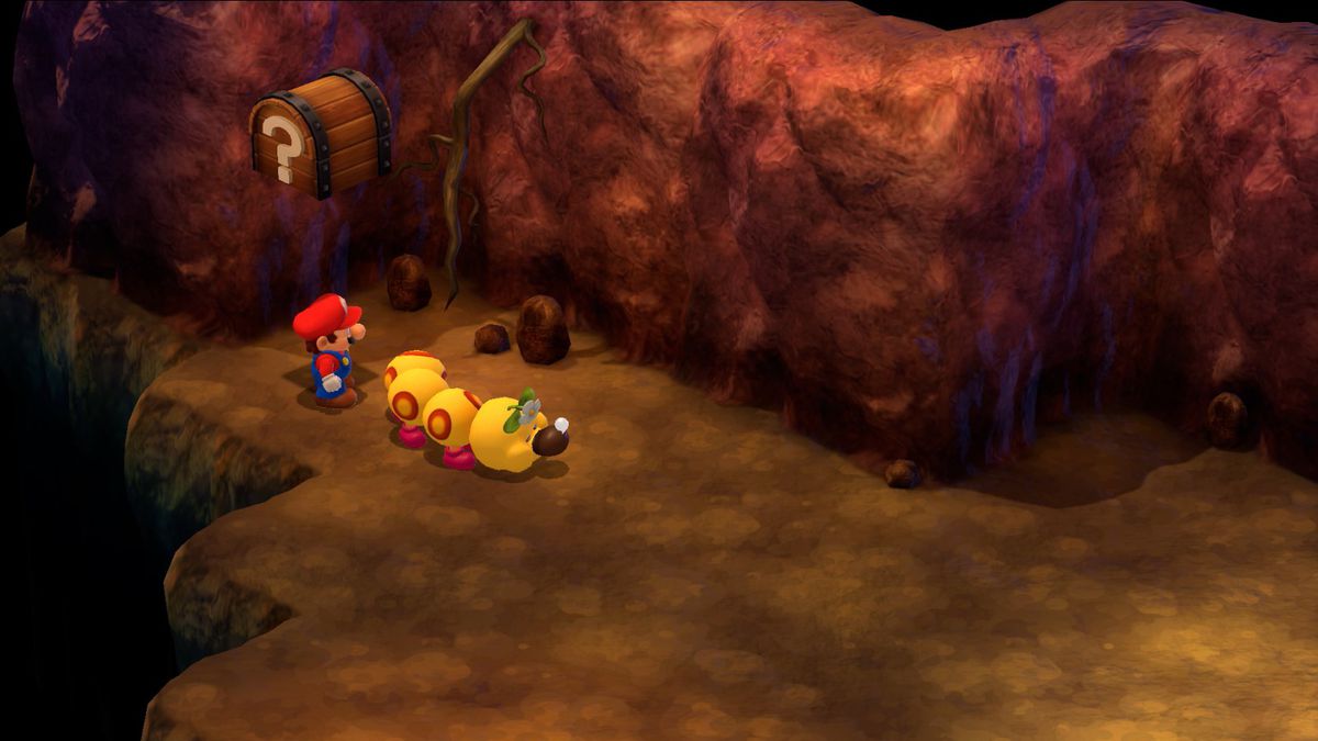 Mario stands under a chest behind a sleeping Wiggler in Super Mario RPG.