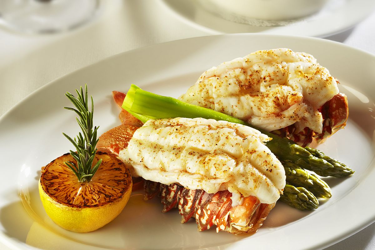 Ocean Prime’s twin lobster tails with asparagus and drawn butter for $49