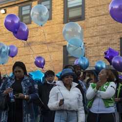 Family and community members gather together for a memorial and balloon release for 12-year-old Erica Gibson, Tuesday, May 11, 2021. Erica was shot and killed in Hazel Crest last weekend.