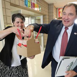 Gov. Gary Herbert and education adviser Tami Pyfer are given  milkshakes after visiting Rose Springs Elementary School in Stansbury Park on Wednesday, Aug. 22, 2018. During his visit, Herbert looked over school safety measures and met with Tooele County School District counselors to discuss aspects of school climate.