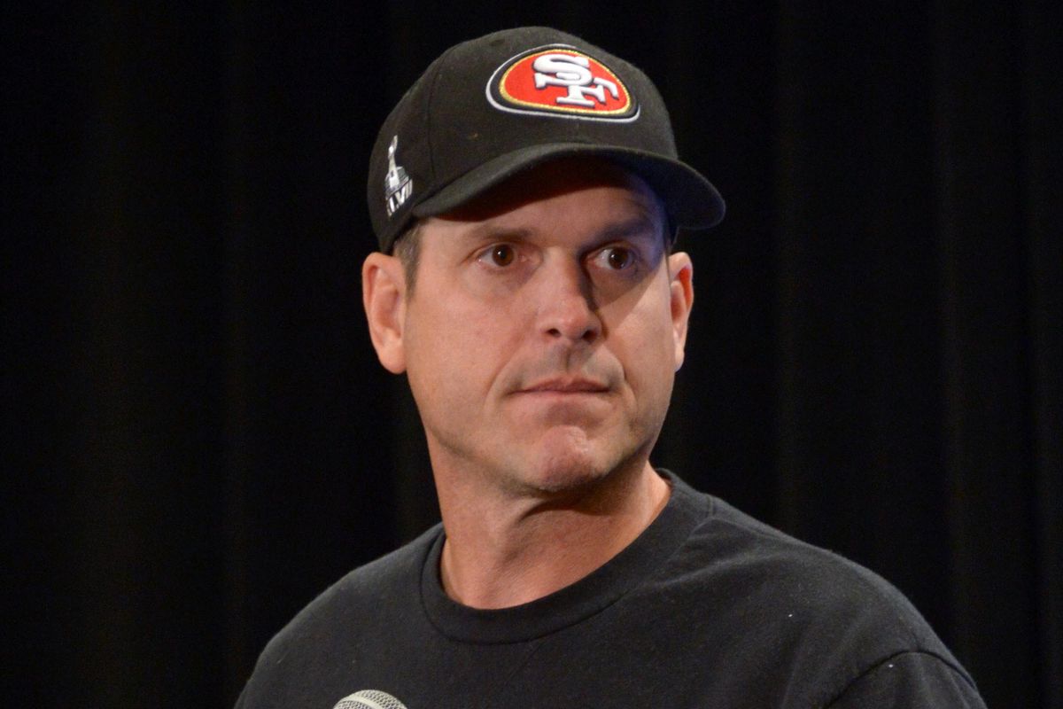 Jim Harbaugh quickly deciphering whether it's a good question or gobble gobble turkey talk from a jive turkey gobbler.