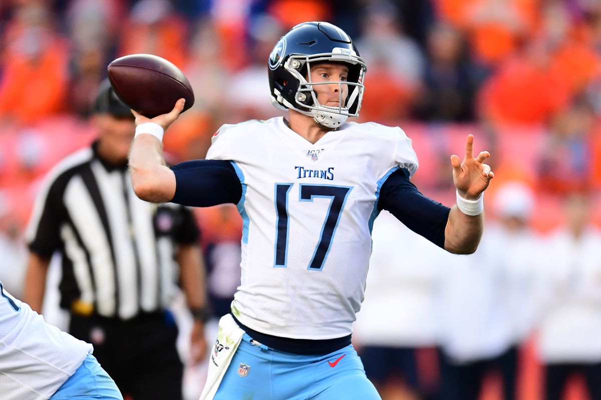 Tennessee Titans quarterback Ryan Tannehill passes the ball in the fourth quarter against the against the Denver Broncos at Empower Field at Mile High.