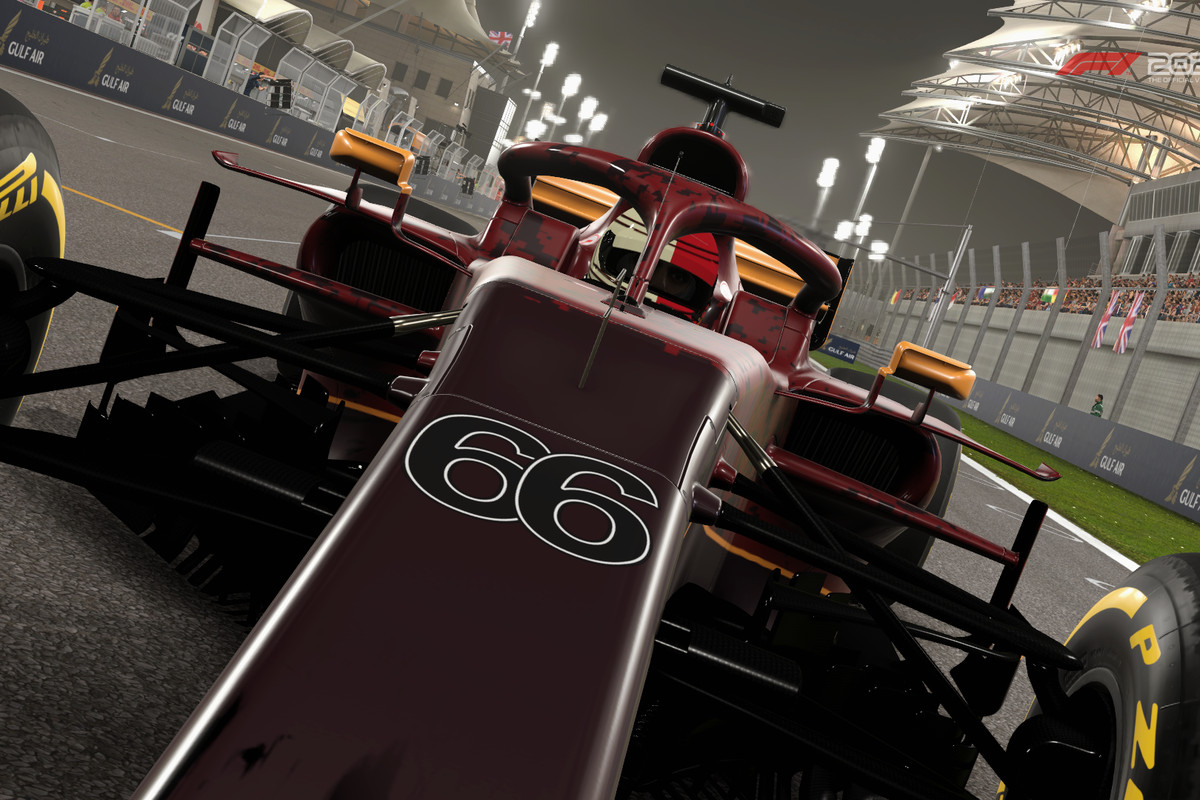 tilt-frame shot of a Formula 1 car racing into the foreground at Bahrain International Circuit, Sakhir