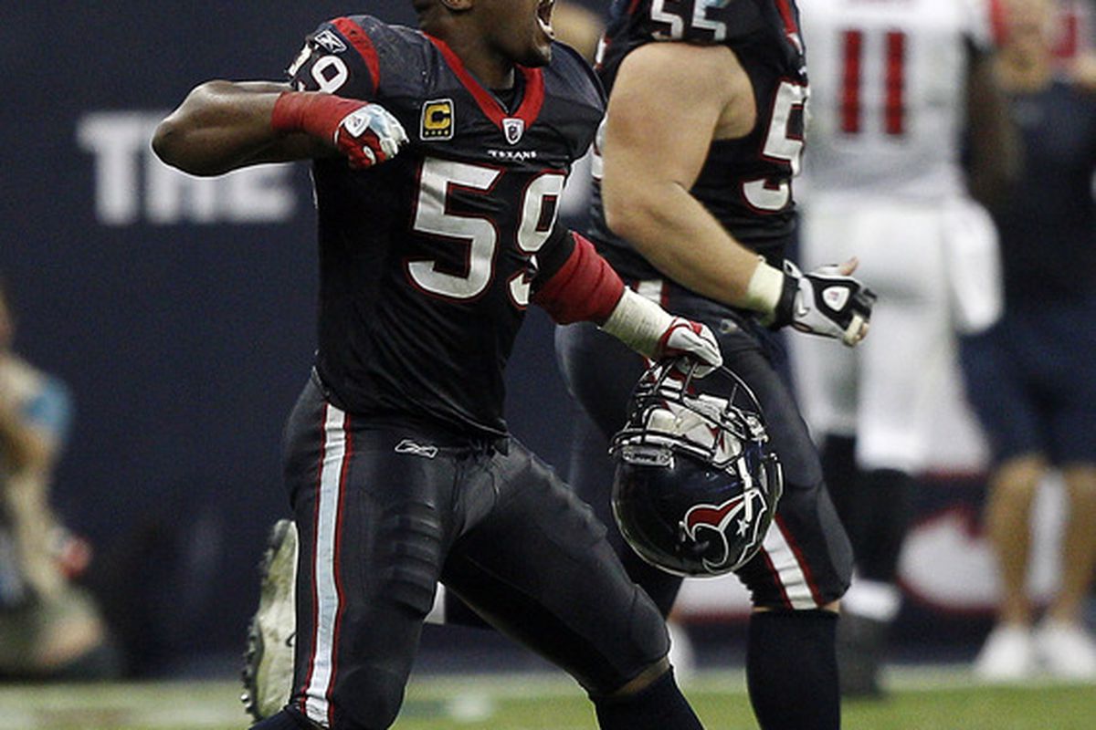 HOUSTON - DECEMBER 04:  DeMeco Ryans #59 of the Houston Texans celebrates after the Houston Texans defeated the Atlanta Falcons at Reliant Stadium on December 4, 2011 in Houston, Texas.  (Photo by Bob Levey/Getty Images)