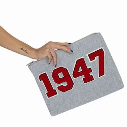 <a href="http://www.pixiemarket.com/catalog/product/view/id/17009/s/1947-clutch/category/39/">1947 clutch</a>, $18 (was $49).