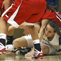 Fremont's Mikel Beus scrambles for a loose ball under a pair of American Fork players during the 5A quarterfinals as the Cavemen won.