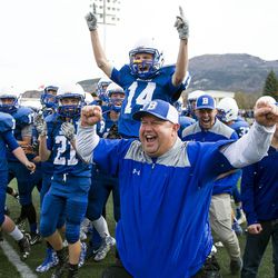 Beaver head coach Randy Hunter celebrates with his team after they defeated South Summit in the UHSAA 2A state championship football game at Southern Utah University in Cedar City on Saturday, Nov. 12, 2016. Beaver defended its crown with a 55-35 win over South Summit.