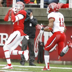 Dres Anderson catches a pass and runs in to score a touchdown during the Red-White game at Rice-Eccles Stadium at the University of Utah in Salt Lake City on Saturday, April 20, 2013.