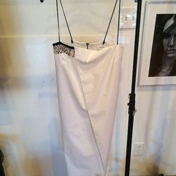 "<strong>Helmut Lang</strong> pieces are always so effortless cool and comfortable for women to wear. This piece was exquisite—a blank canvas to make you shine. I love the white because you can pair it with any color in your wardrobe. The pop of neutral s