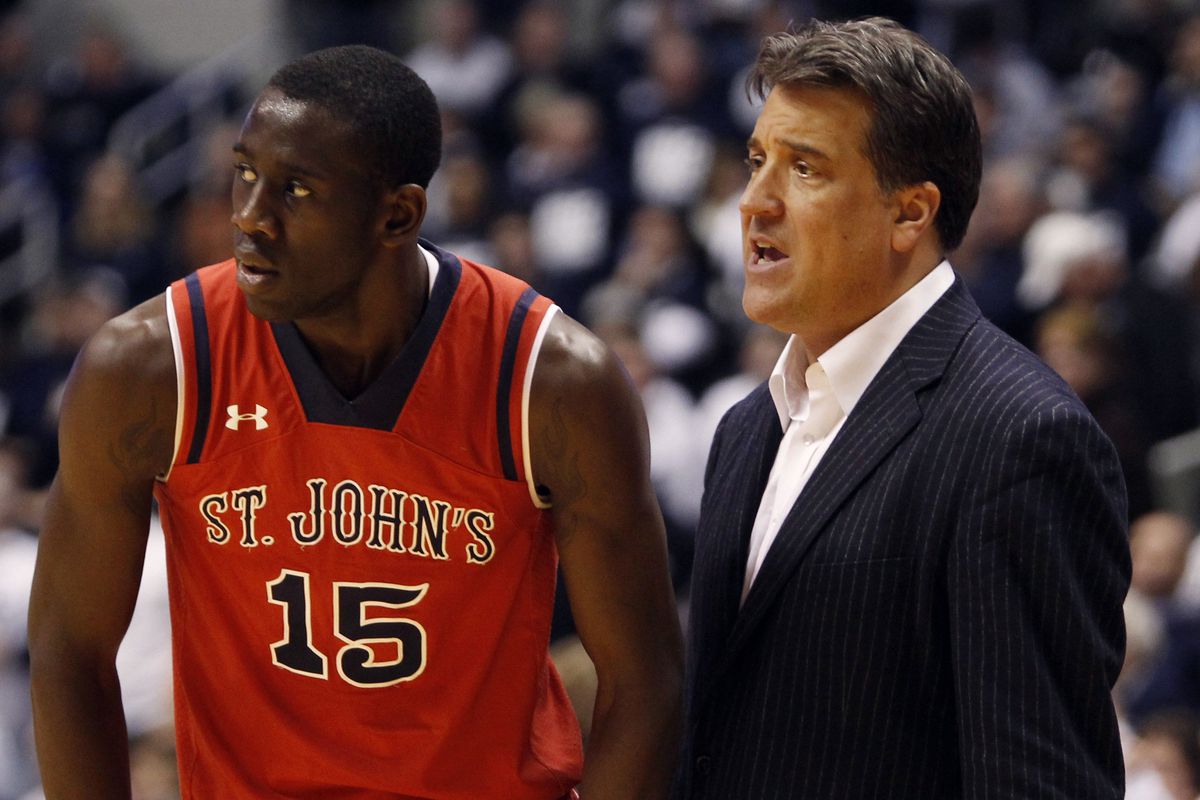 Dec 31, 2013; Cincinnati, OH, USA; St. John's Red Storm head coach Steve Lavin talks to guard/forward Sir'Dominic Pointer (15) during the second half against the Xavier Musketeers at the Cintas Center. Xavier defeated St. John's 70-60.