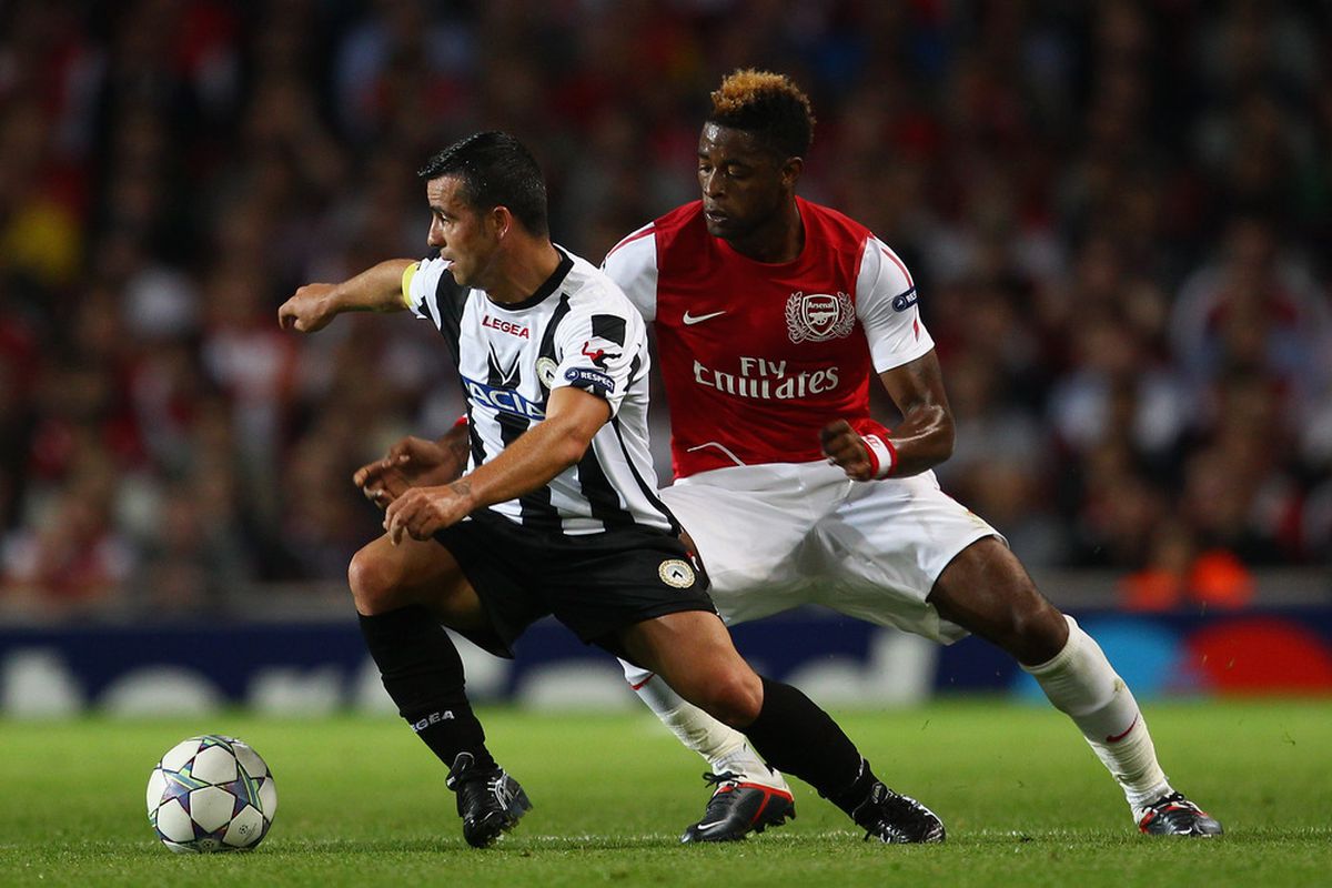 Antonio Di Natale of Udinese iis closed down by Alex Song of Arsenal during the UEFA Champions League play-off first leg match between Arsenal and Udinese at the Emirates Stadium in London, England.  (Photo by Julian Finney/Getty Images)