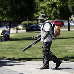 Misi Bloomfield with Salt Lake City Parks works on the grounds at Pioneer Park in Salt Lake City on Wednesday, June 1, 2016.