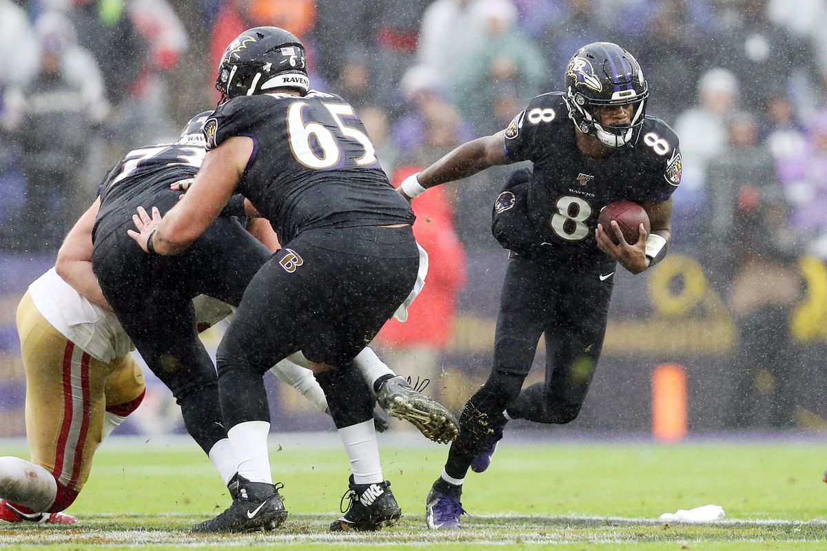 Lamar Jackson of the Baltimore Ravens runs with the ball during the first half against the San Francisco 49ers at M&amp;T Bank Stadium on December 01, 2019 in Baltimore, Maryland.