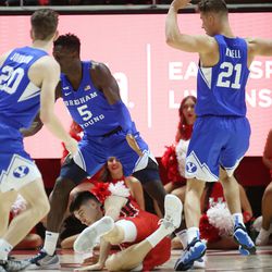 Utah Utes guard Lazar Stefanovic (20) is surrounded by Brigham Young Cougars in Salt Lake City on Saturday, Nov. 27, 2021. BYU won 75-64.
