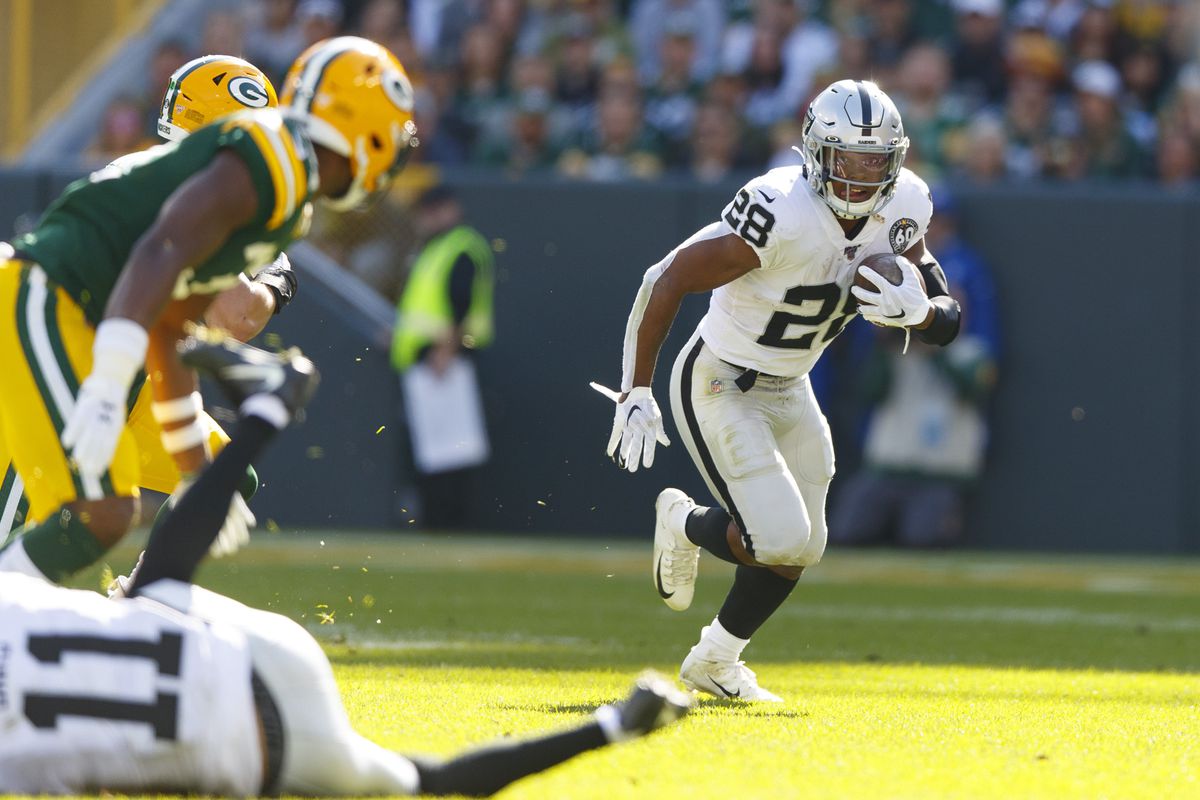 Oakland Raiders running back Josh Jacobs rushes with the football during the first quarter against the Green Bay Packers at Lambeau Field.