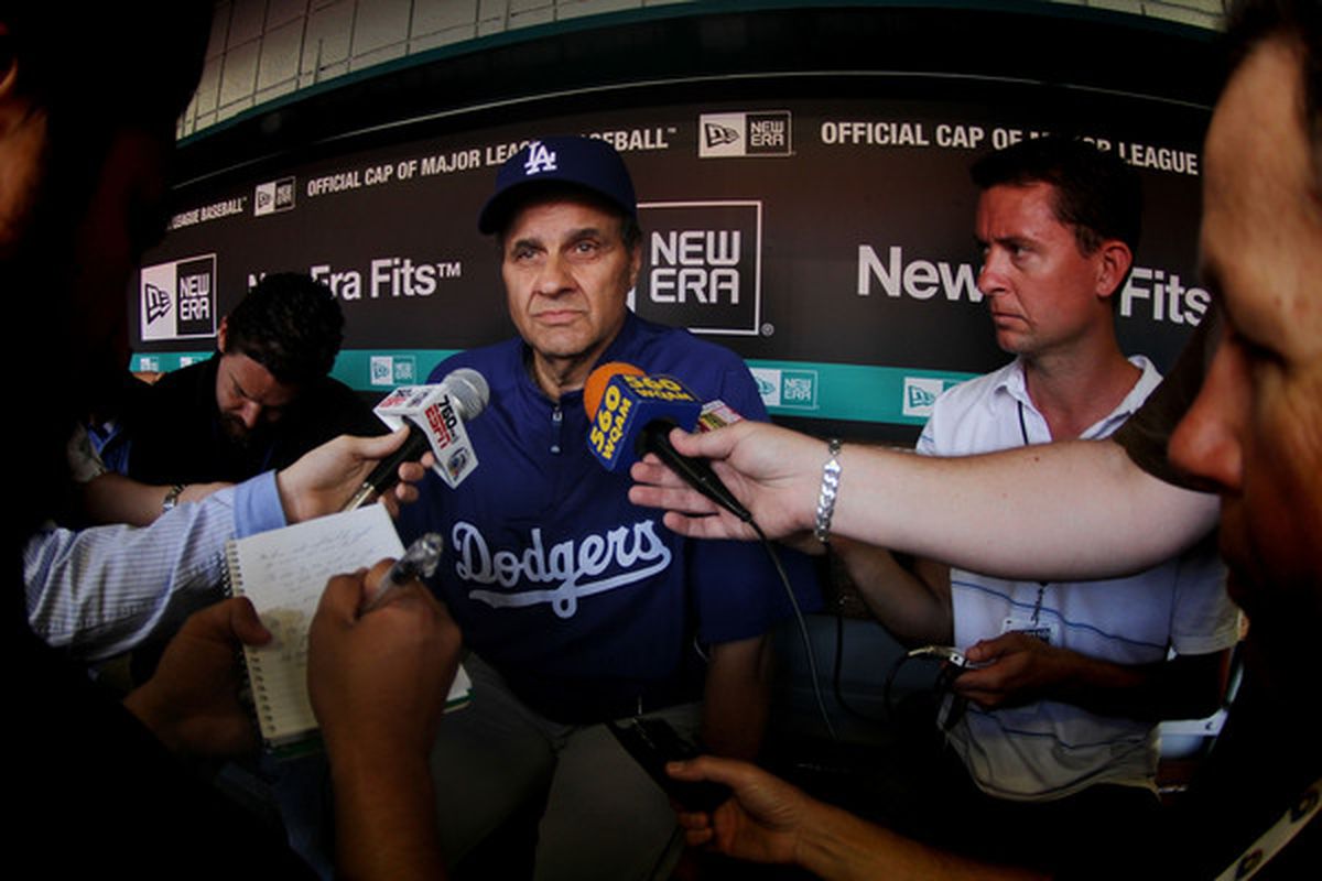 Tony Jackson (left) and Josh Suchon (right) were among reporters asking questions of Joe Torre before today's game.
