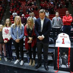 Paul Huntsman, son of Jon M. Huntsman Sr., his wife Cheryl and other family members stand for a moment of silence honoring the elder Huntsman before the Utah basketball game against the Stanford Cardinal at the Huntsman Center in Salt Lake City on Thursday, Feb. 8, 2018.