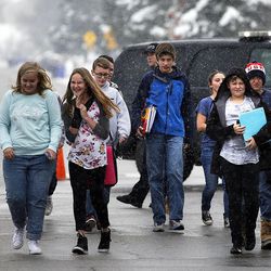 Students walk from the school to meet with their parents following a shooting incident at Mueller Park Junior High School in Bountiful on Thursday, Dec. 1, 2016.