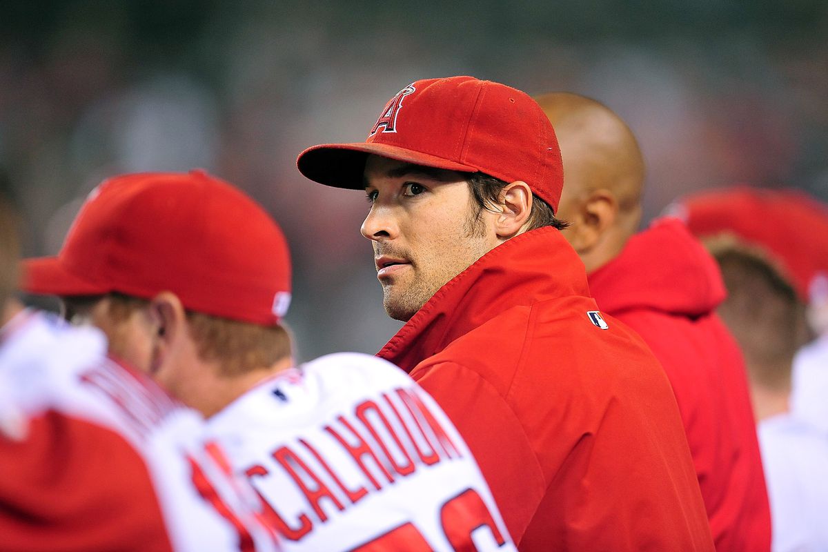 September 21, 2012; Anaheim, CA, USA; Los Angeles Angels starting pitcher C.J. Wilson (33) watches game action in the third inning against the Chicago White Sox at Angel Stadium. Mandatory Credit: Gary A. Vasquez-US PRESSWIRE