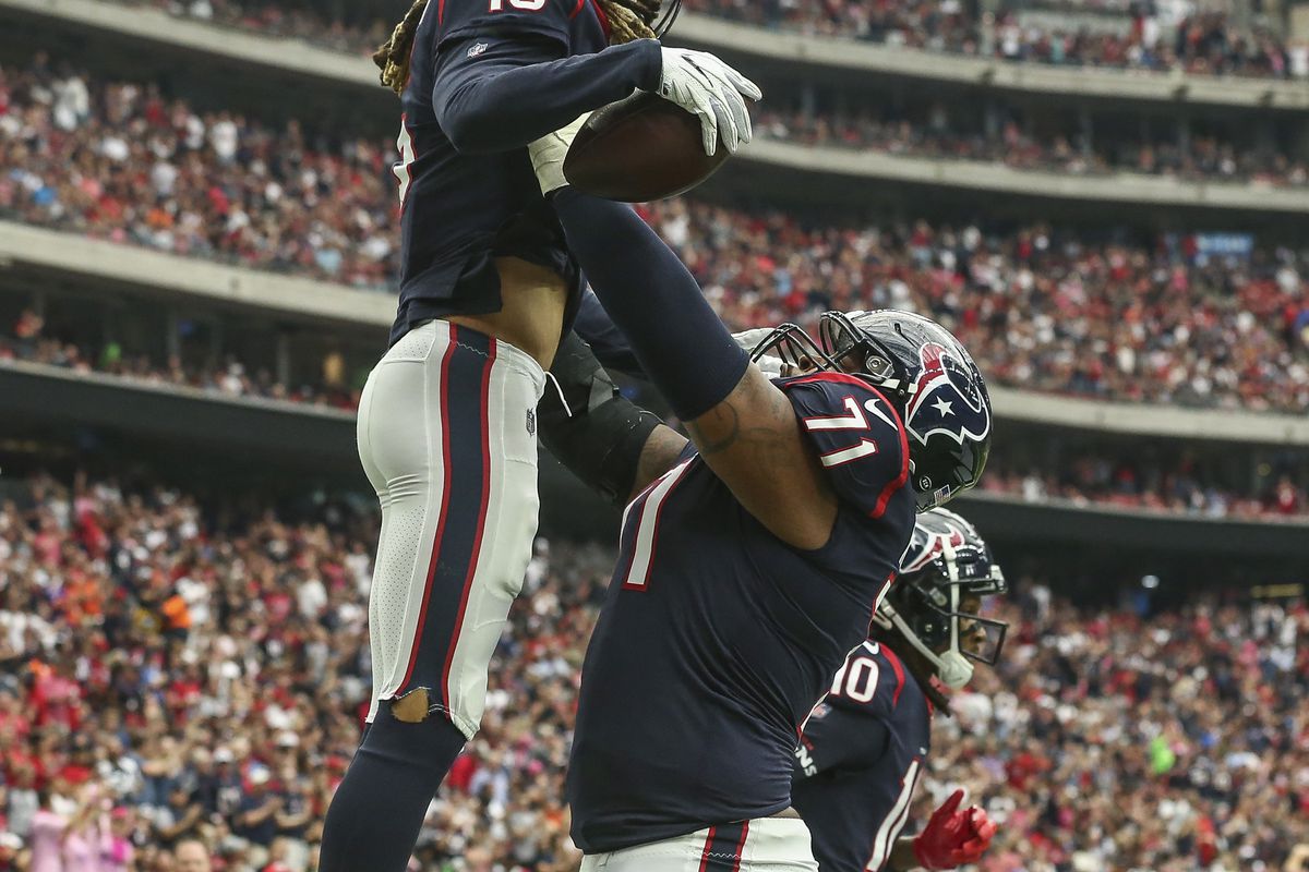 Houston Texans wide receiver Will Fuller celebrates with offensive tackle Tytus Howard  after scoring a touchdown against the Atlanta Falcons during the first quarter at NRG Stadium.