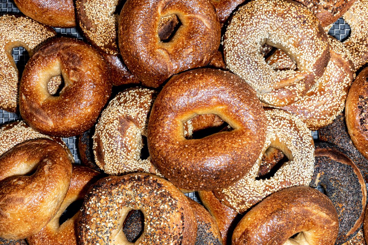 A mountain of golden bagels from Bagel and Slice in Highland Park.