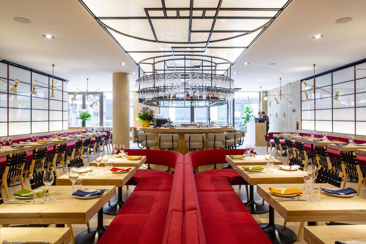 The sleek, symmetrical red interior at Ottolenghi’s new restaurant, Rovi