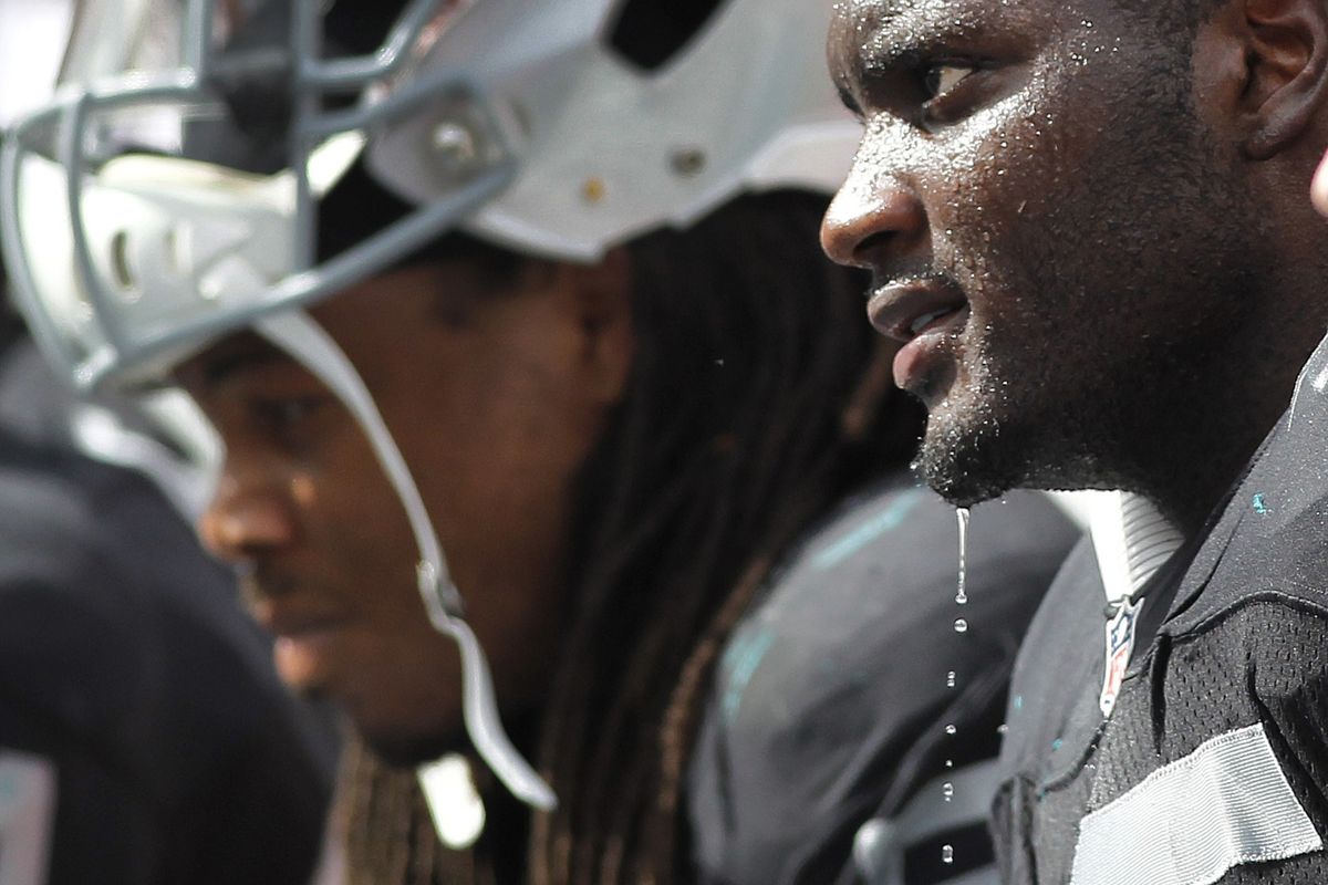 Oakland Raiders middle linebacker Rolando McClain (55) sits on the bench in the fourth quarter in a game against the Miami Dolphins