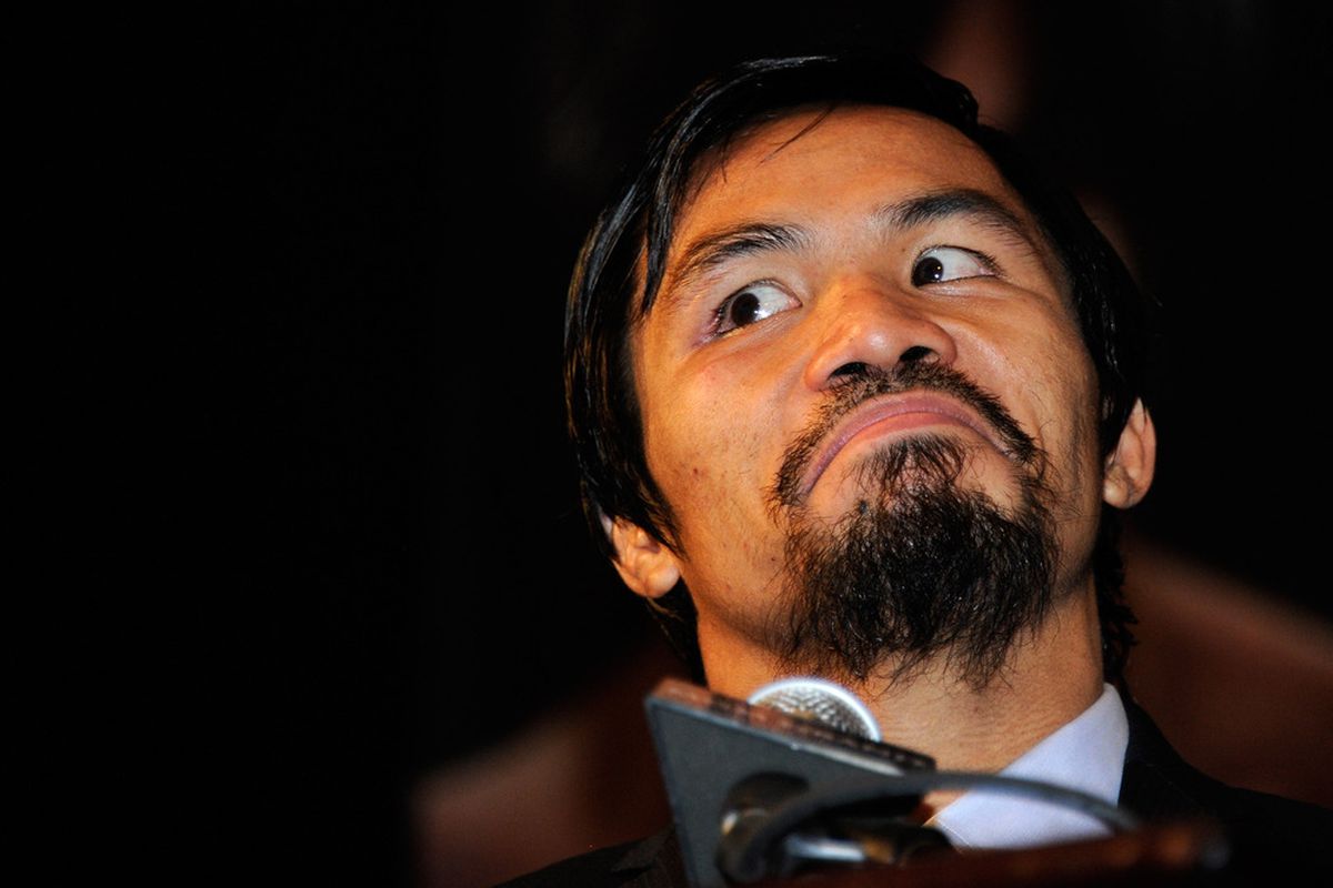 Manny Pacquiao is DIABOLICALLY planning a third fight with Juan Manuel Marquez. Bwahaha! (I just like this photo.) (Photo by Ethan Miller/Getty Images)