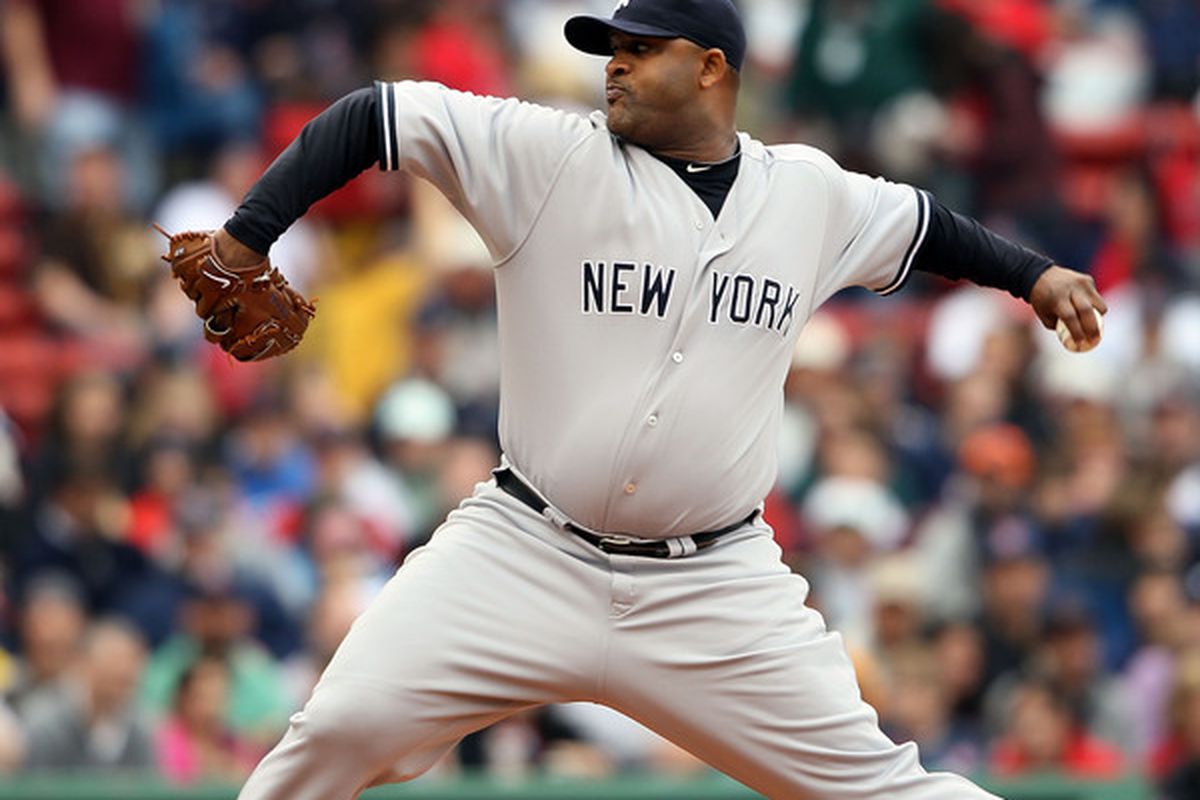 BOSTON - MAY 08:  CC Sabathia #52 of the New York Yankees delivers a pitch in the first inning against the Boston Red Sox on May 8, 2010 at Fenway Park in Boston, Massachusetts.  (Photo by Elsa/Getty Images)
