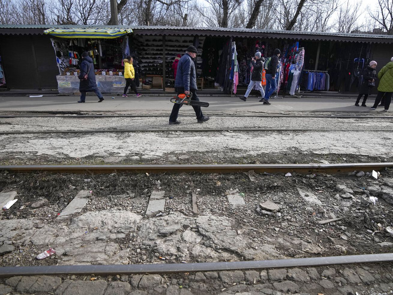 Local residents pass in Mariupol, Ukraine.